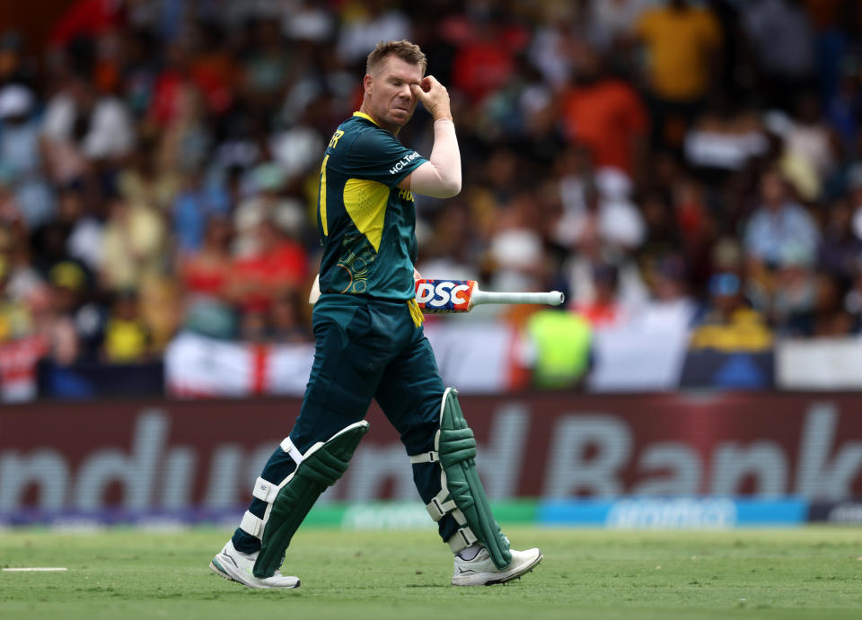 BRIDGETOWN, BARBADOS - JUNE 08: David Warner of Australia reacts after being dismissed by Moeen Ali of England during the ICC Men's T20 Cricket World Cup West Indies & USA 2024 match between Australia  and England at  Kensington Oval on June 08, 2024 in Bridgetown, Barbados. (Photo by Matthew Lewis-ICC/ICC via Getty Images)