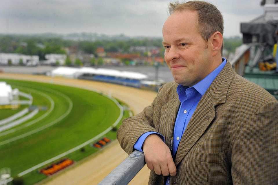 Larry Collmus, seen here at Pimlico, has called Triple Crown races for 12 years. (Karl Merton Ferron / Getty Images)