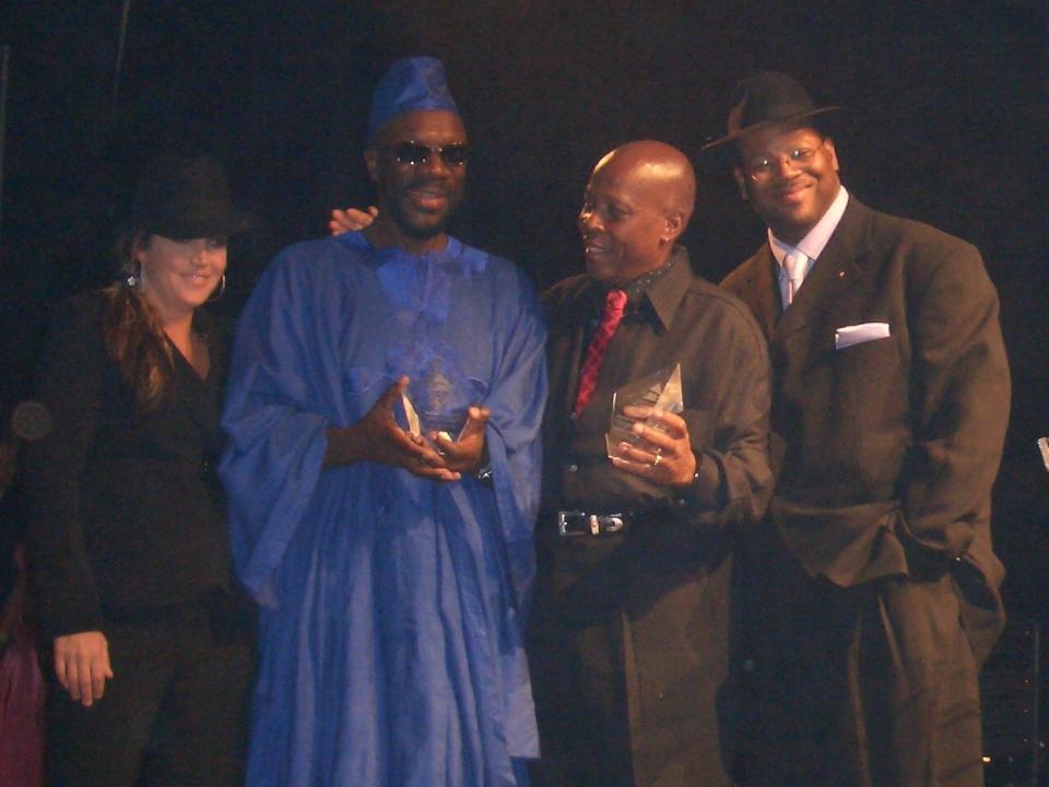 Lisa Marie Presley (far left), Stax Records songwriter Isaac Hayes (in the blue), Stax songwriter David Porter and music producer Jimmy Jam (far right) at The Recording Academy HONORS ceremony in 2005 at the Memphis Cook Convention Center.
