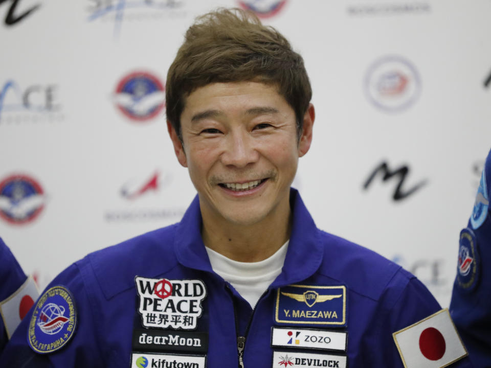 Space flight participant Yusaku Maezawa attends a news conference ahead of the expedition to the International Space Station at the Gagarin Cosmonauts' Training Center in Star City outside Moscow, Russia, Thursday, Oct. 14, 2021. A Japanese fashion tycoon who's booked a SpaceX ride to the moon is going to try out the International Space Station first. Yusaku Maezawa announced that he's bought two seats on a Russian Soyuz capsule. He'll blast off in December on the 12-day mission with his production assistant and a professional cosmonaut. (Shamil Zhumatov/Pool Photo via AP)