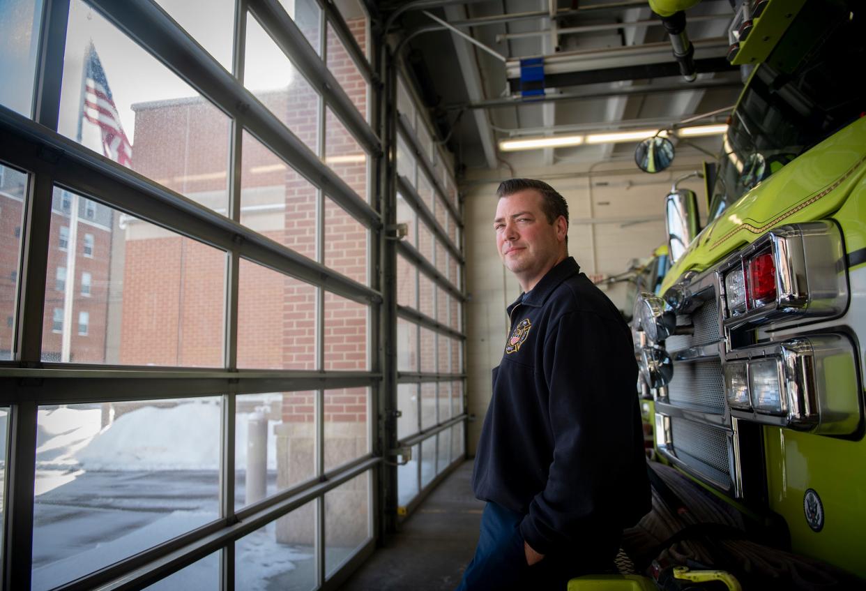 Kent Firefighter Pat Paisley stopped on his way home after his shift the morning of Jan. 17 to help a woman out of her car, which had become stuck in snow on railroad tracks, before it was struck by a train. Paisley is shown here at the Kent fire station on January 25.