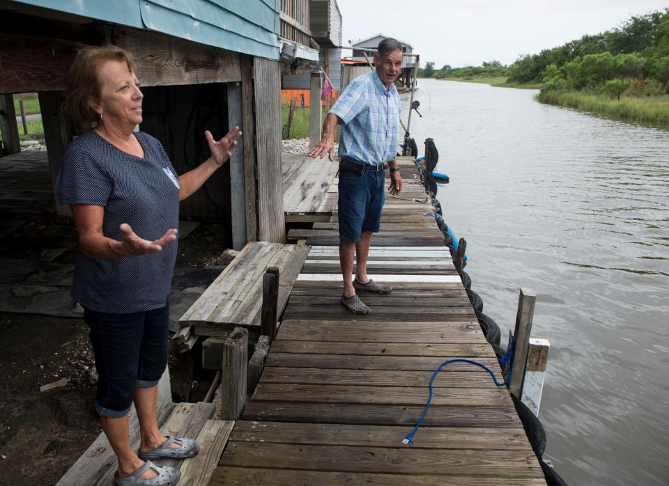 Linda, left, and Lee Morvant talk about the water level at their fish camp in Isle de Jean Charles, La., on Friday, July 12, 2019. Isle de Jean Charles is slowly shrinking due to rising sea levels. 