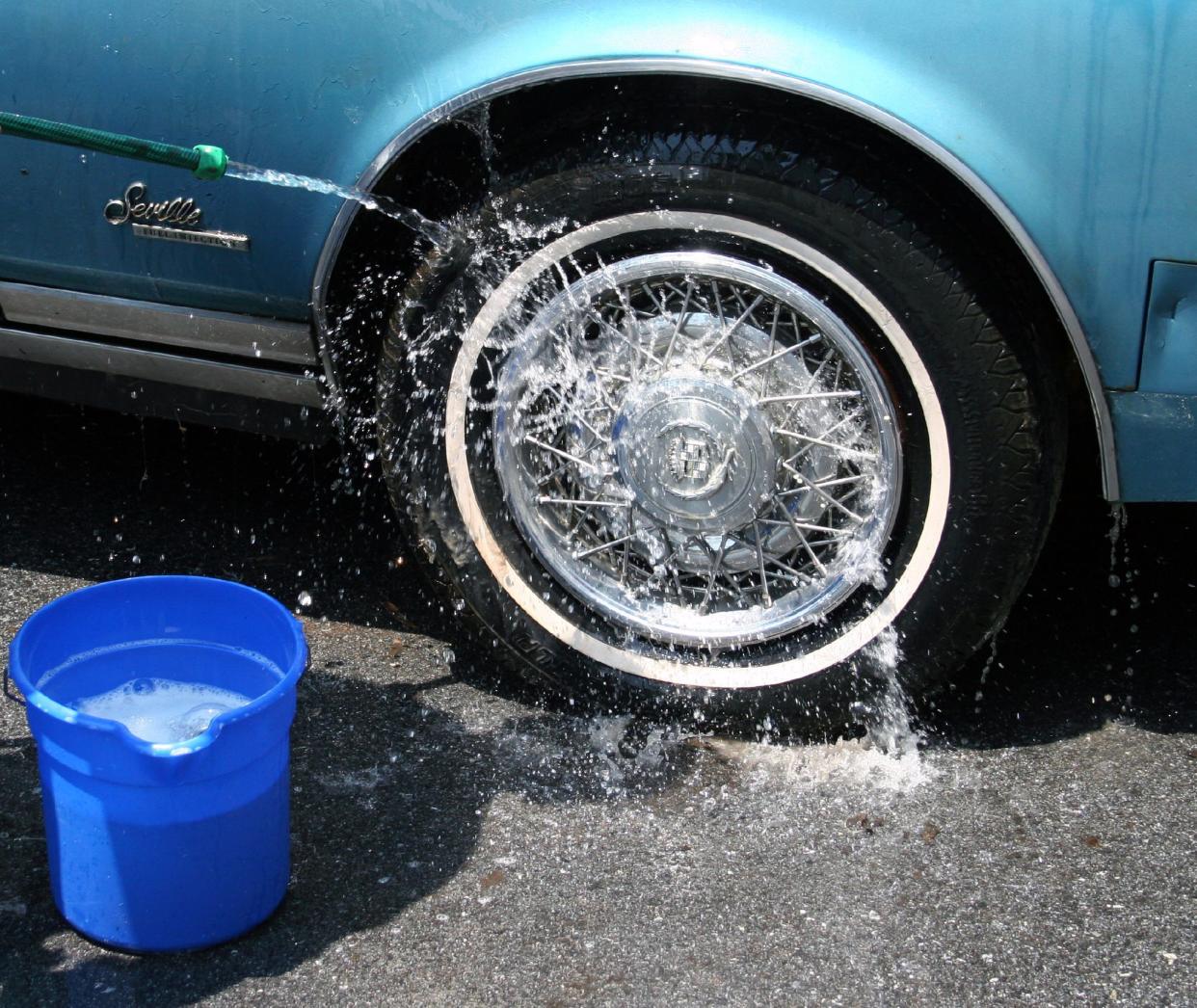 Washing The Seville's Tire And Hubcap