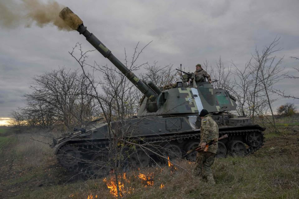 Ukrainian artillery unit members fire toward Kherson on Oct. 28, 2022.