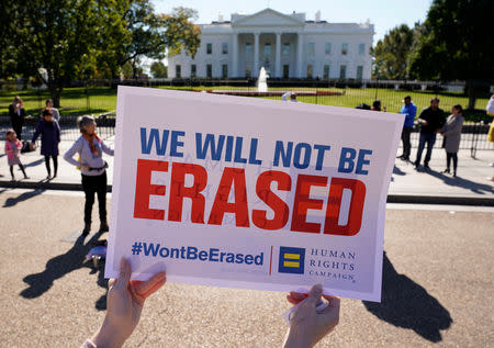 Transgender rights activists protest the government's alleged attempt to strip transgender people of official recognition at the White House in Washington, U.S., October 22, 2018. REUTERS/Kevin Lamarque