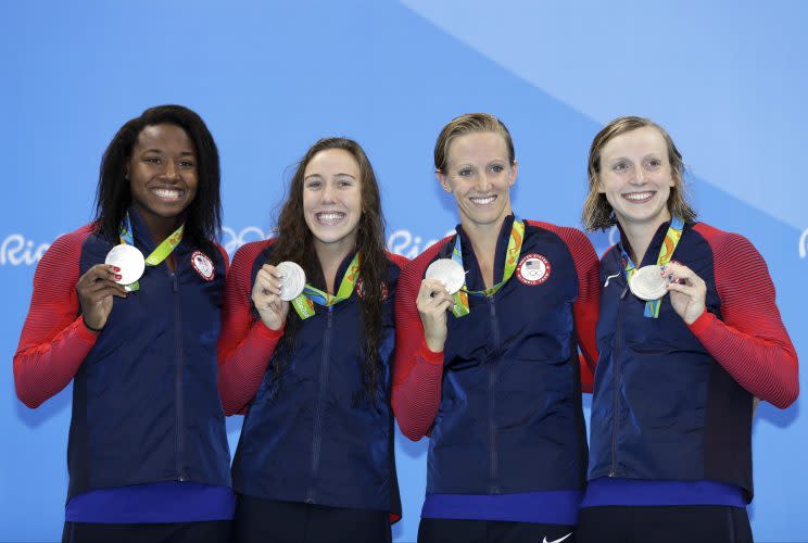 From left, Simone Manuel, Abbey Weitzeil, Dana Vollmer and Katie Ledecky show off their silver medals Saturday. (AP)