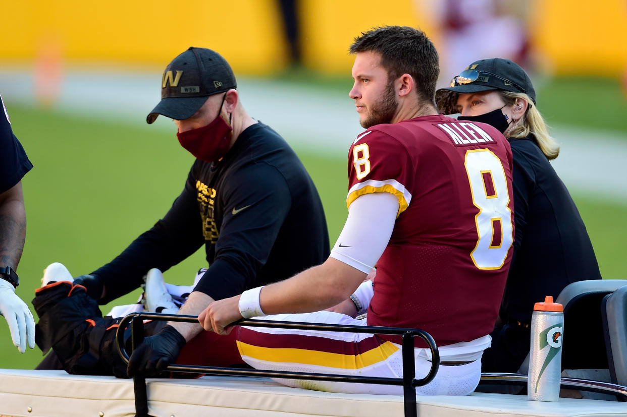 LANDOVER, MARYLAND - NOVEMBER 08: Kyle Allen #8 of the Washington Football Team is carted off the field after being injured in the first quarter against the New York Giants at FedExField on November 08, 2020 in Landover, Maryland. (Photo by Patrick McDermott/Getty Images)