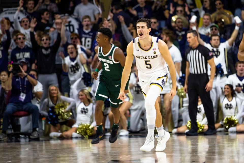 Notre Dame's Cormac Ryan (5) celebrates during the first half of the team's NCAA college basketball game against Michigan State on Wednesday, Nov. 30, 2022, in South Bend, Ind. (AP Photo/Michael Caterina)