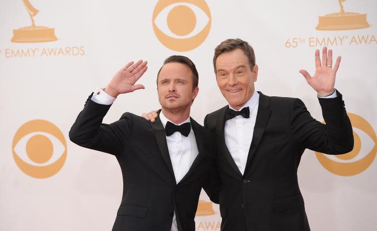 Breaking Bad actors Bryan Cranston (R) and Aaron Paul arrive on the red carpet for the 65th Emmy Awards in Los Angeles, California, on September 22, 2013