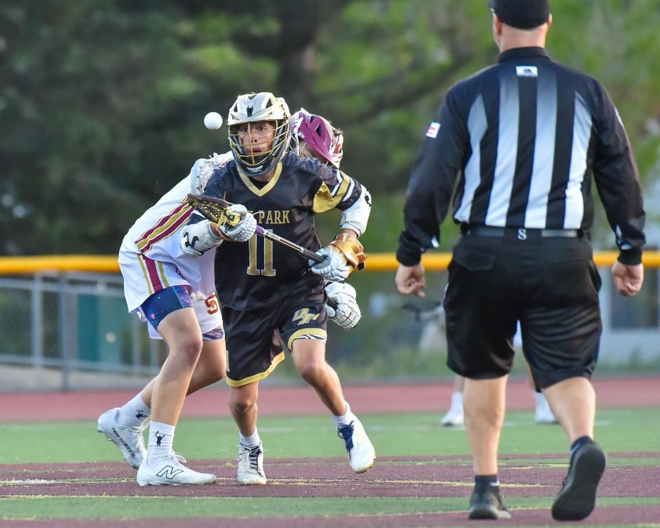 Oak Park's Micah DeCloedt tries to corral the ball during the Eagles' 19-6 win over Simi Valley on Thursday, April 11, 2024. DeCloedt had four goals and an assist as Oak Park extended its winning streak to eight games.