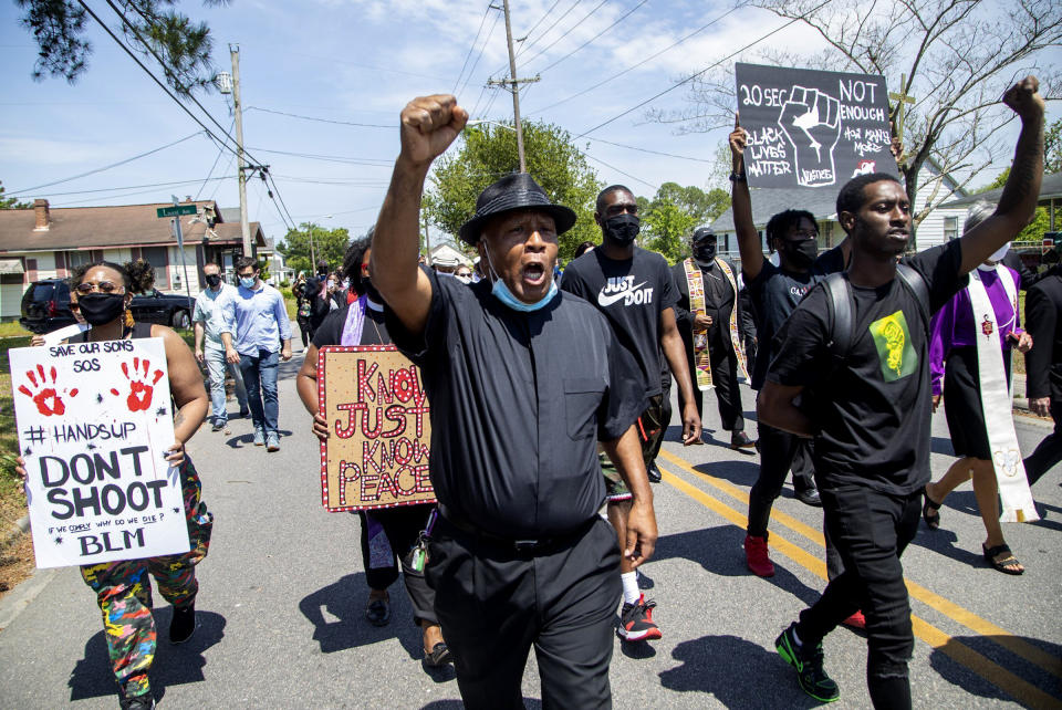 Image: Demonstrators, led by clergy, march on April 28, 2021 from Mt. Lebanon AME Zion Church in Elizabeth City to the site where Andrew Brown Jr. was shot and killed by Pasquotank County Sheriff deputies. (Travis Long / The News and Observer via AP)