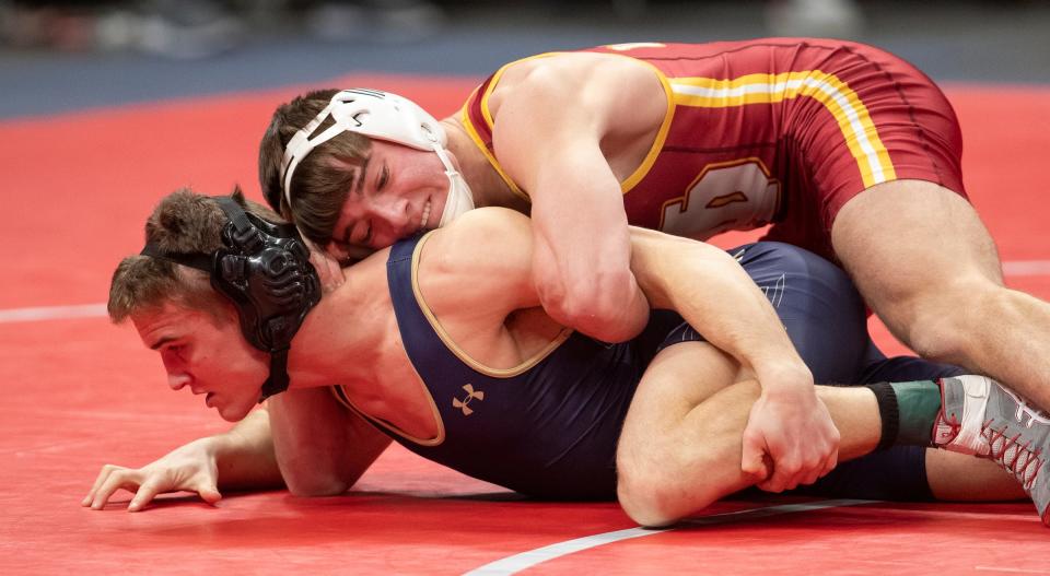 Landon Buchanan of Jimtown High School, wins this match with Bray Emerine of Floyd Central High School, on Friday at Bankers Life Fieldhouse in Indianapolis.