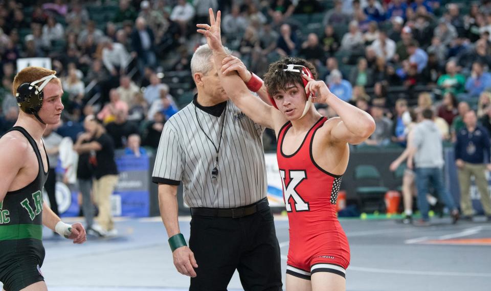 Kingsway's Nathan Taylor has his arm raised after defeating Camden Catholic's Jackson Young, 7-0, during a 126 lb. quarterfinal round bout of the NJSIAA individual wrestling championships tournament at Jim Whelan Boardwalk Hall in Atlantic City on Friday, March 3, 2023.