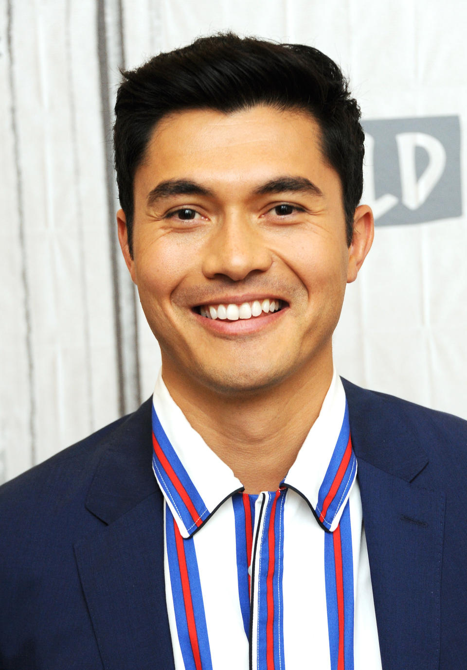 Henry Golding smiling