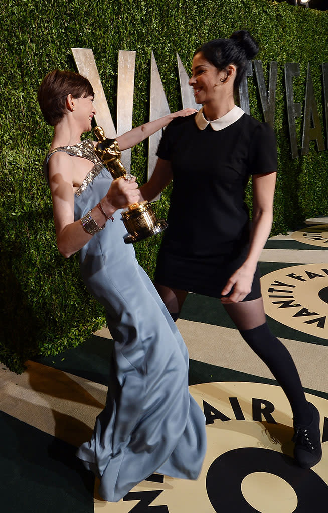 Anne Hathaway and Sarah Silverman arrive for the 2013 Vanity Fair Oscar Party hosted by Graydon Carter at Sunset Tower on February 24, 2013 in West Hollywood, California.