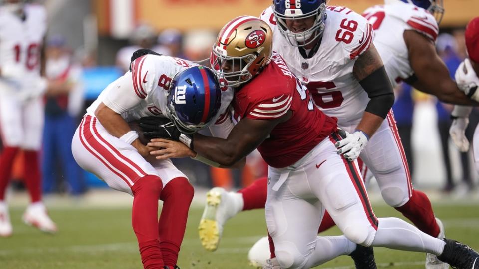 New York Giants quarterback Daniel Jones (8) is sacked by San Francisco 49ers defensive tackle Javon Hargrave (98) in the second quarter at Levi's Stadium.