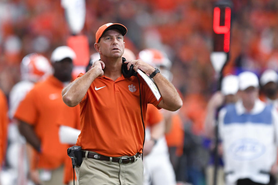 Clemson head coach Dabo Swinney watches the video board during the first half of an NCAA college football game against Syracuse in Syracuse, N.Y., Saturday, Sept. 30, 2023. (AP Photo/Adrian Kraus)