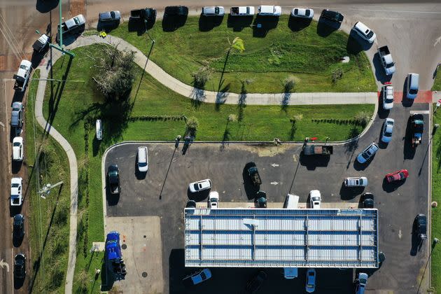 In this aerial view, vehicles line up to purchase gasoline in the wake of Hurricane Ian on Sept. 30 in Port Charlotte. (Photo: Win McNamee via Getty Images)