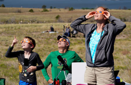People watch the total solar eclipse in Guernsey, Wyoming U.S. August 21, 2017. REUTERS/Rick Wilking