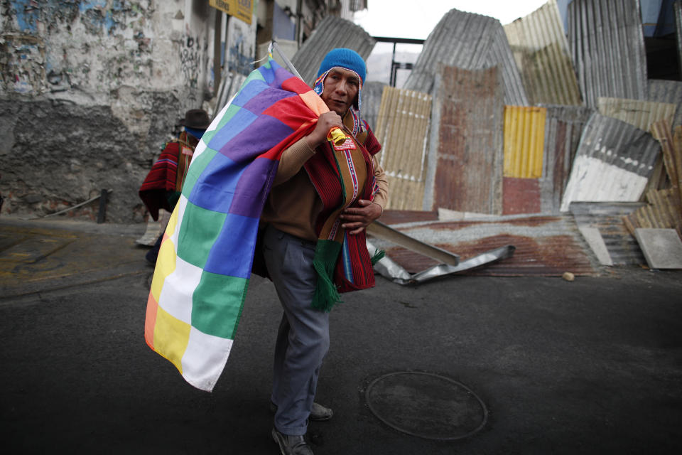 A supporter of former President Evo Morales marches in La Paz, Bolivia, Thursday, Nov. 14, 2019. Morales resigned and flew to Mexico under military pressure following massive nationwide protests over alleged fraud in an election last month in which he claimed to have won a fourth term in office. (AP Photo/Natacha Pisarenko)