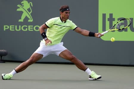 Mar 26, 2017; Miami, FL, USA; Rafael Nadal of Spain hits a forehand against Philip Kohlschreiber of Germany (not pictured) on day six of the 2017 Miami Open at Crandon Park Tennis Center. Mandatory Credit: Geoff Burke-USA TODAY Sports