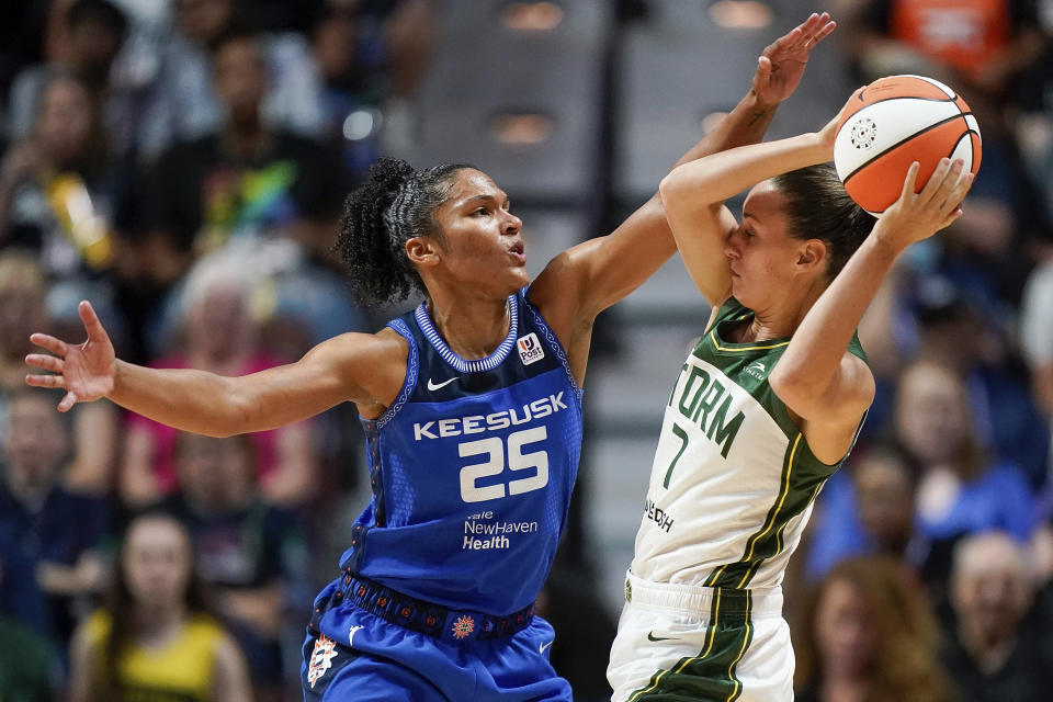 Seattle Storm forward Stephanie Talbot (7) is defended by Connecticut Sun forward Alyssa Thomas (25) during the second half of the WNBA basketball game Thursday, July 28, 2022, in Uncasville, Conn. (AP Photo/Bryan Woolston)