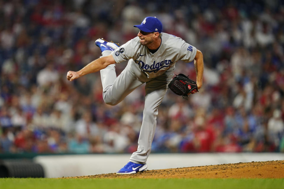 Los Angeles Dodgers' Max Scherzer follows through on a pitch during the fourth inning of a baseball game against the Philadelphia Phillies, Tuesday, Aug. 10, 2021, in Philadelphia. (AP Photo/Matt Slocum)