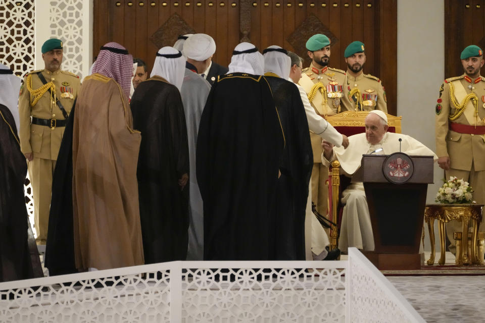 Pope Francis meets authorities upon his arrival al at the Sakhir Royal Palace, Bahrain, for a meeting with Bahrain's King Hamad bin Isa Al Khalifa, Thursday, Nov. 3, 2022. Pope Francis is making the November 3-6 visit to participate in a government-sponsored conference on East-West dialogue and to minister to Bahrain's tiny Catholic community, part of his effort to pursue dialogue with the Muslim world. (AP Photo/Alessandra Tarantino)