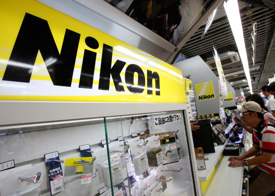 Nikon Corp's logo is pictured at an electronics store in Tokyo August 9, 2012. Nikon shares fell as much as 12 percent on Thursday, a day after the camera maker lowered its full-year operating profit forecast below market expectations to reflect a change in its foreign exchange rate assumption for the euro.   REUTERS/Yuriko Nakao (JAPAN - Tags: BUSINESS EMPLOYMENT)