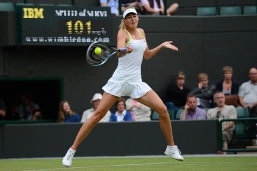 Maria Sharapova plays a forehand shot during her match against Tsvetana Pironkova on Thursday. Sharapova was forced to dig deep before securing her place in the Wimbledon third round with a 7-6 (7/3), 6-7 (3/7), 6-0 victory