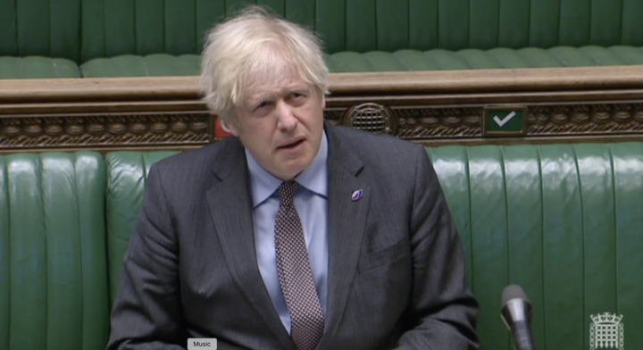 Boris Johnson reacts after being accused of offending bereaved families. (Parliament TV)