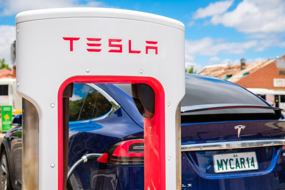 Adelaide CBD, Australia - November 18, 2017: Tesla Supercharger EV charging station with Tesla Model X car in city centre on Franklin Street on a day