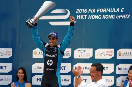 Formula E - FIA Formula E Hong Kong ePrix , Hong Kong - 9/10/16. Renault-eDAMS's Sebastien Buemi (C) of Switzerland celebrates on podium. REUTERS/Bobby Yip