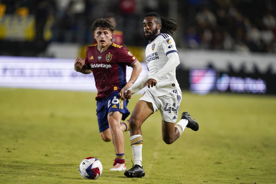LA Galaxy forward Raheem Edwards, right, dribbles the ball as Real Salt Lake midfielder Diego Luna chases during the second half of an MLS soccer match Saturday, Oct. 14, 2023, in Carson, Calif. (AP Photo/Ryan Sun)