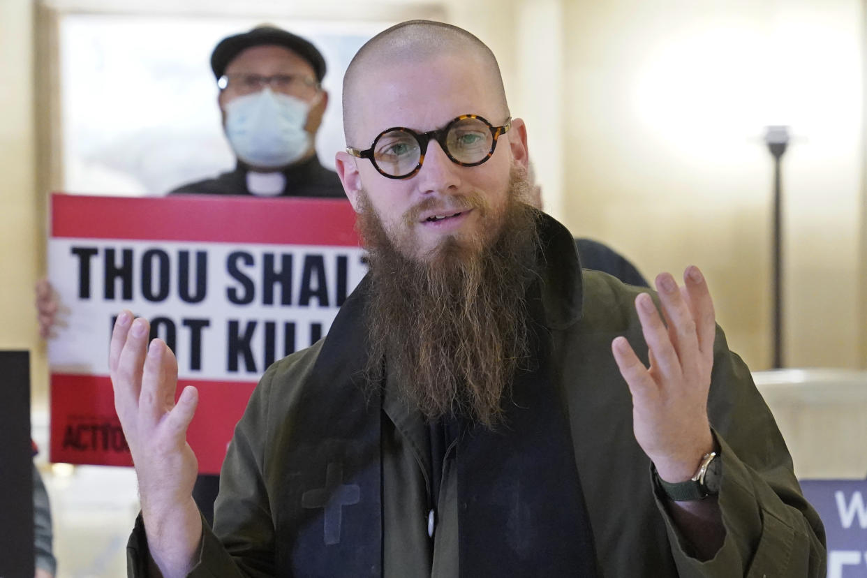 The Rev. Jeffrey Hood, of Arkansas, speaks to the media before protestors deliver petitions against the death penalty to the office of Oklahoma Gov. Kevin Stitt, Wednesday, Jan. 11, 2023, in Oklahoma City. The Oklahoma Department of Corrections has reversed its position and now says it will allow Hood, an anti-death penalty minister, inside the execution chamber for the upcoming execution of Scott Eizember. Eizember was convicted of killing A.J. Cantrell, 76, and his wife, Patsy Cantrell, 70, in 2003. (AP Photo/Sue Ogrocki)