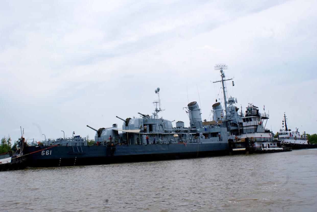 The U.S.S. Kidd ferried through the Houma Navigational Canal, May 2. It is being towed to Thoma-Sea Marina for repairs.