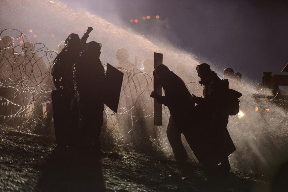 Police use a water cannon on protesters during a protest against plans to pass the Dakota Access pipeline near the Standing Rock Indian Reservation, near Cannon Ball, N.D., on Nov. 20, 2016. (Stephanie Keith/Reuters)