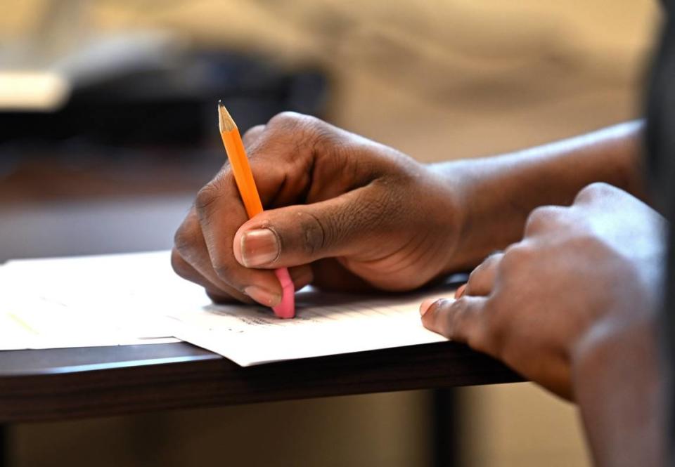 A resident works on an assignment inside a classroom at the Mecklenburg County Juvenile Detention Center. 