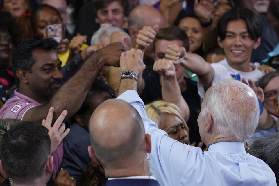 FILE - President Joe Biden greets people after speaking at a rally hosted by the Democratic National Committee at Richard Montgomery High School, Aug. 25, 2022, in Rockville, Md. (AP Photo/Evan Vucci, File)