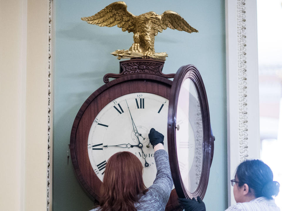 Capitol workers wind the Ohio Clock in the U.S. Capitol in Washington, D.C., on Jan. 21, 2020. / Credit: Bill Clark/CQ-Roll Call Inc. via Getty Images