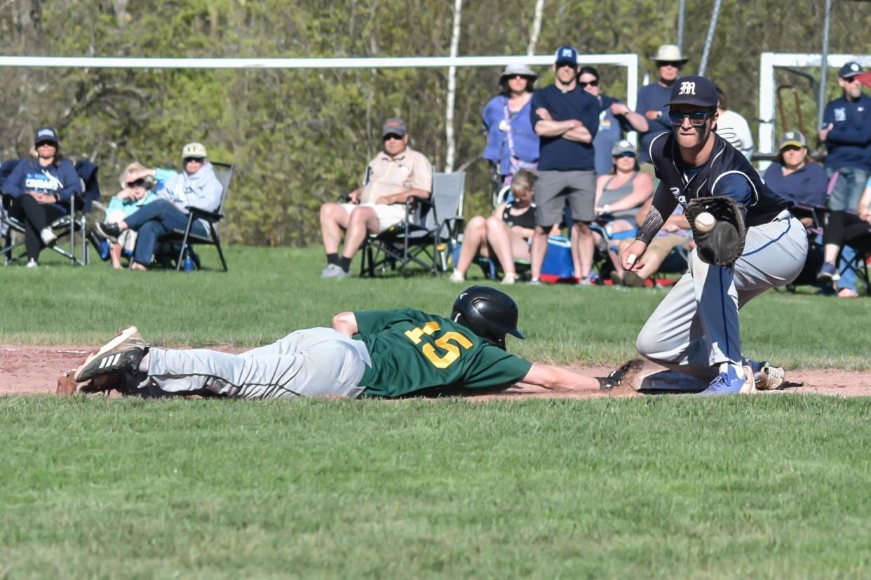 BFA's Carson Neveau beats the throw back to first during the Bobwhites' loss to the Mount Mansfield Cougars in 2023.