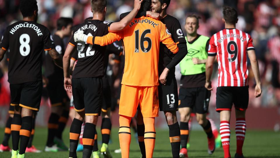 <p>Hull City’s Eldin Jakupovic celebrates at the end of the match with team mates </p>