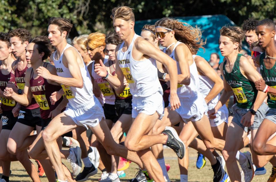 Ventura's Micah Grossman (left) and Hollis Costa run with a pack of runners during the Division II boys race at the CIF State Cross Country Championships on Saturday, Nov. 25, 2023, at Woodward Park in Fresno. Grossman finished 10th and Costa as 33rd as the Cougars placed second overall.