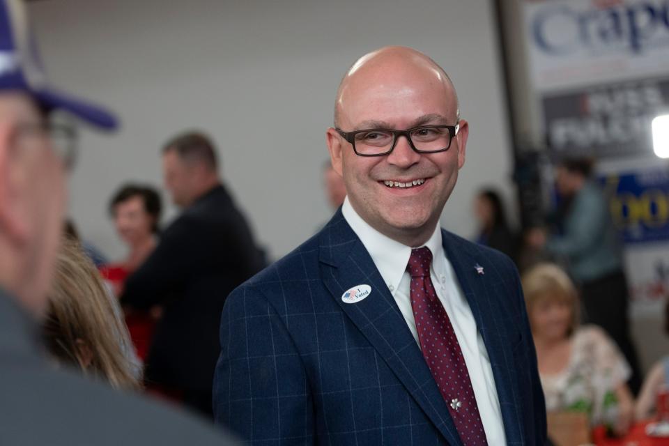 Secretary of State candidate Phil McGrane laughs as he talks with an attendee during the Republican Party primary celebration at the Hilton Garden Inn hotel in Boise, Idaho, Tuesday, May 17, 2022.