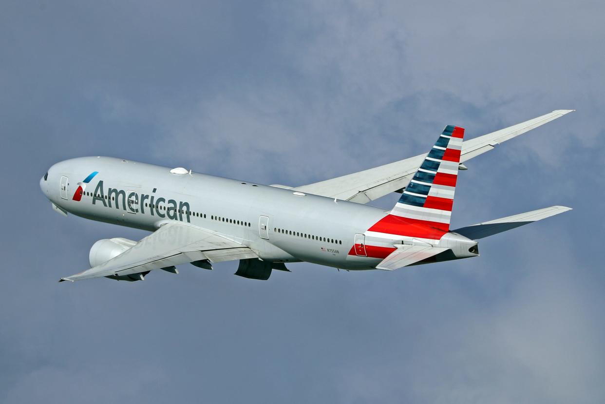 An American Airlines plane flying.