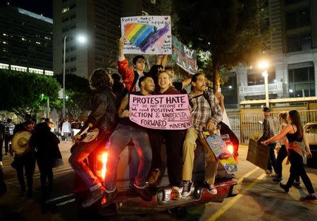 Protestors march in the streets of Downtown Los Angeles during march and rally against the election of Republican Donald Trump as President of the United States in Los Angeles, California, U.S. November 12, 2016. REUTERS/Kevork Djansezian