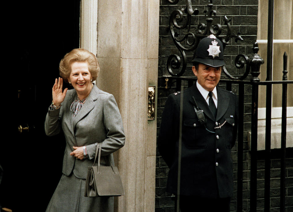 FILE - Britain's Prime Minister Margaret Thatcher waves to the media on returning to No. 10 Downing Street from Buckingham Palace, in London, May 11, 1980. Two people are running to be Britain’s next prime minister, but a third presence looms over the contest: Margaret Thatcher. Almost a decade after her death, the late former prime minister casts a powerful spell over Britain's Conservative Party. In the race to replace Boris Johnson as Conservative leader and prime minister, both Foreign Secretary Liz Truss and former Treasury chief Rishi Sunak claim to embody the values of Thatcher. (AP Photo/John Redman, File)