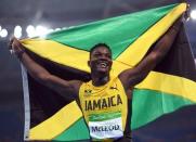 2016 Rio Olympics - Athletics - Final - Men's 110m Hurdles Final - Olympic Stadium - Rio de Janeiro, Brazil - 16/08/2016. Omar McLeod (JAM) of Jamaica celebrates after winning the race REUTERS/Dylan Martinez