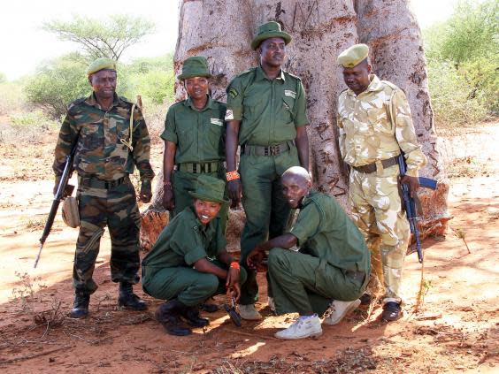 The community rangers team, in dark green, work together with the KWS rangers, in camouflage, on foot patrols around the park (Sue Watt)