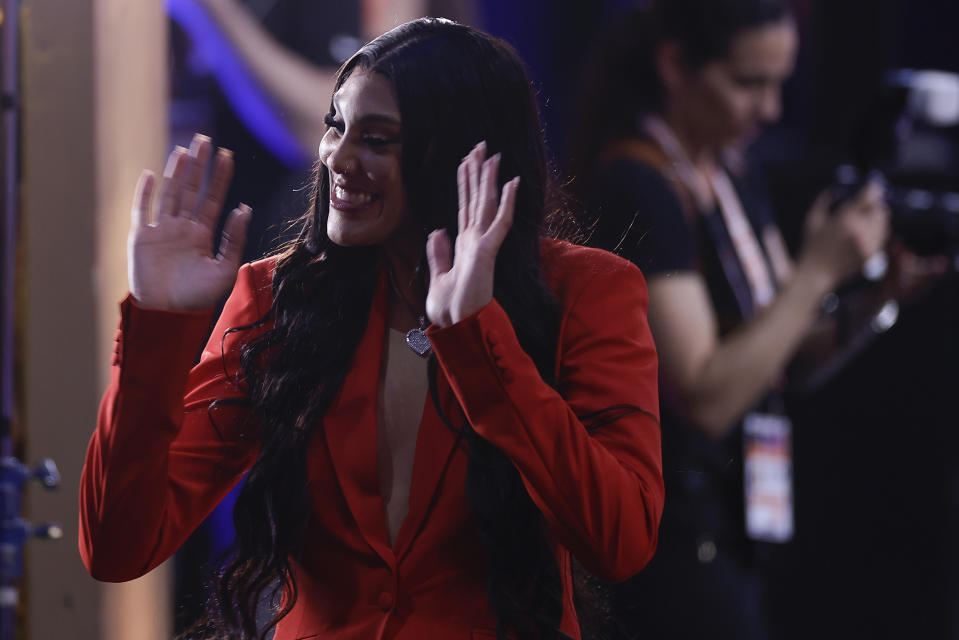 South Carolina's Kamilla Cardoso reacts after being selected third overall by the Chicago Sky during the first round of the WNBA basketball draft, Monday, April 15, 2024, in New York. (AP Photo/Adam Hunger)